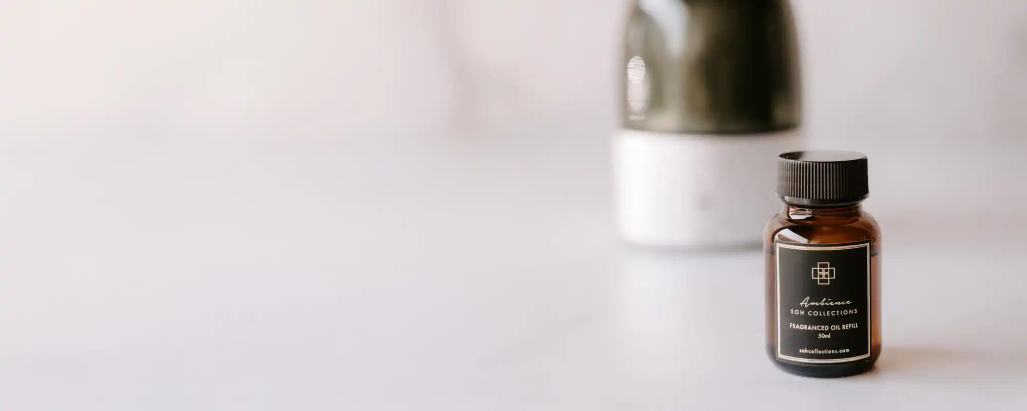 Small amber glass bottle with a black label and cap.