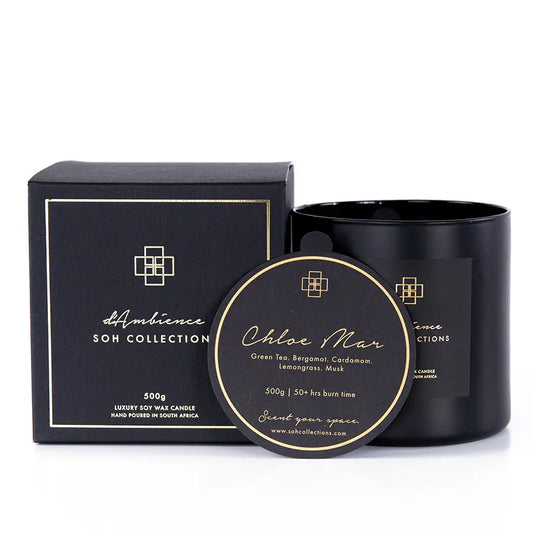 Black candle and box set with gold accents from Chloe Mar featuring green tea scent