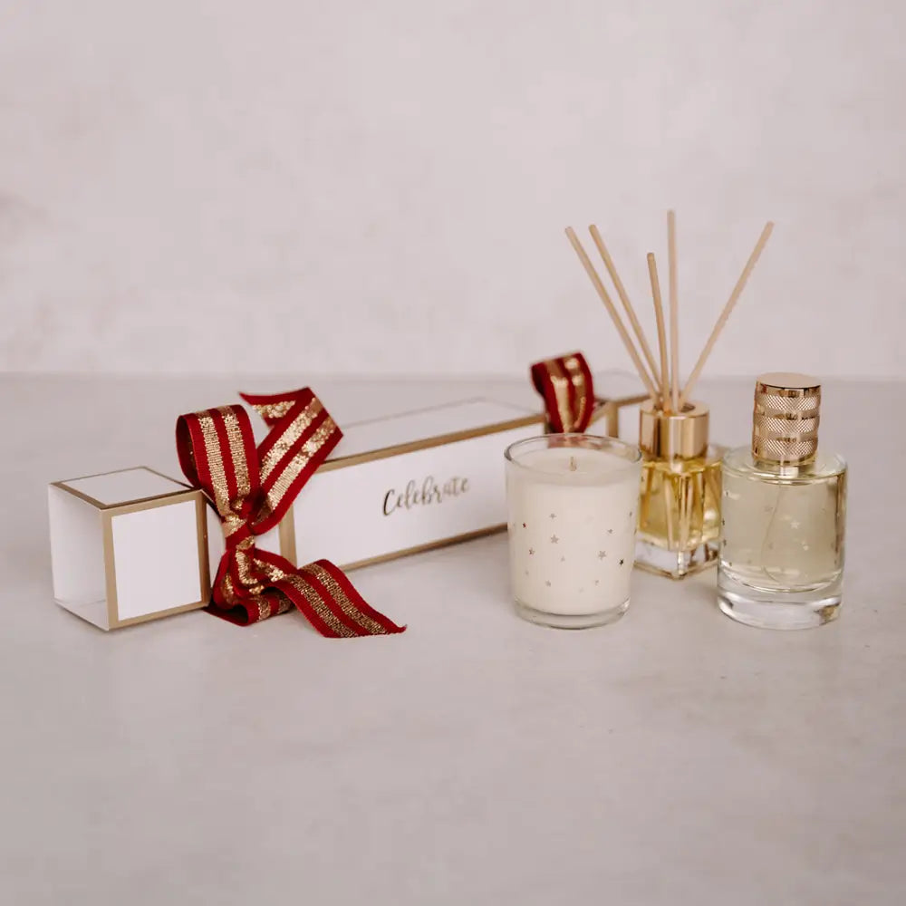 Festive Christmas cracker gift set with candle and diffusers for holiday celebration