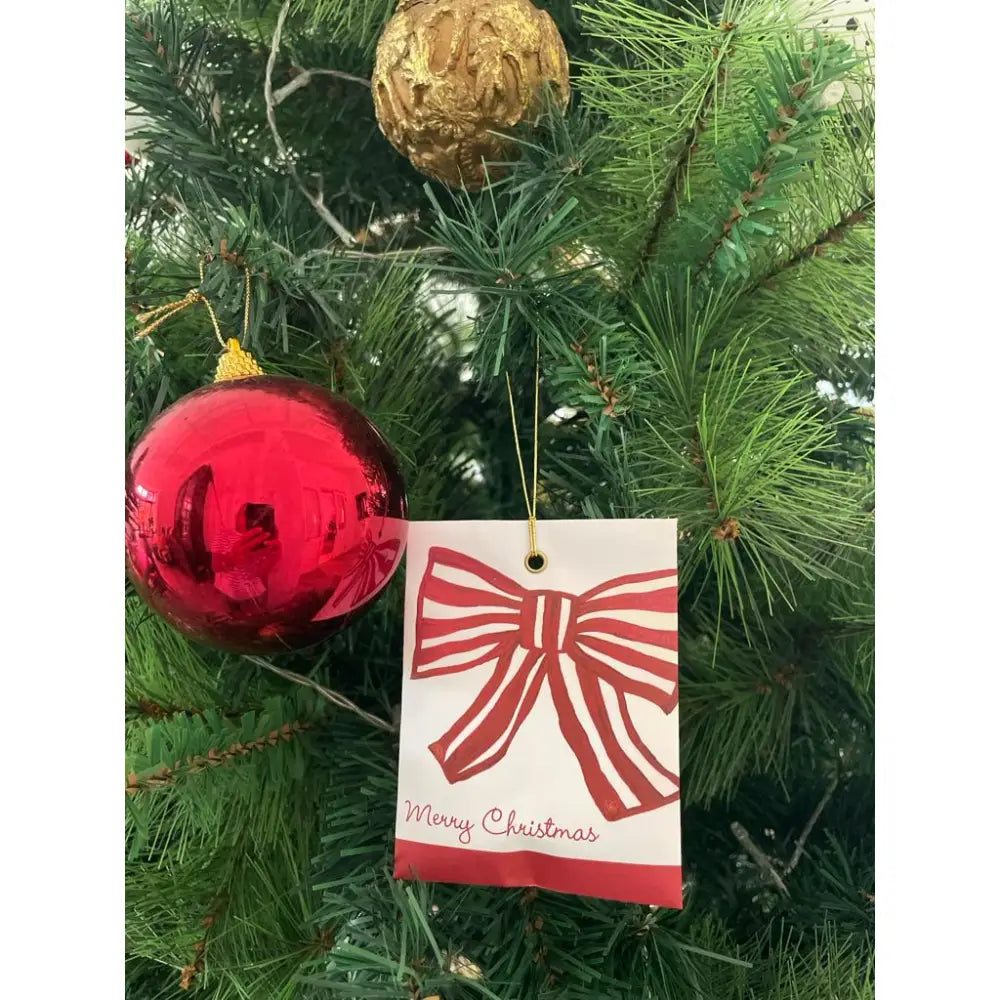 Festive Christmas tree with ornaments and decorative tag for seasonal scented diffuser product