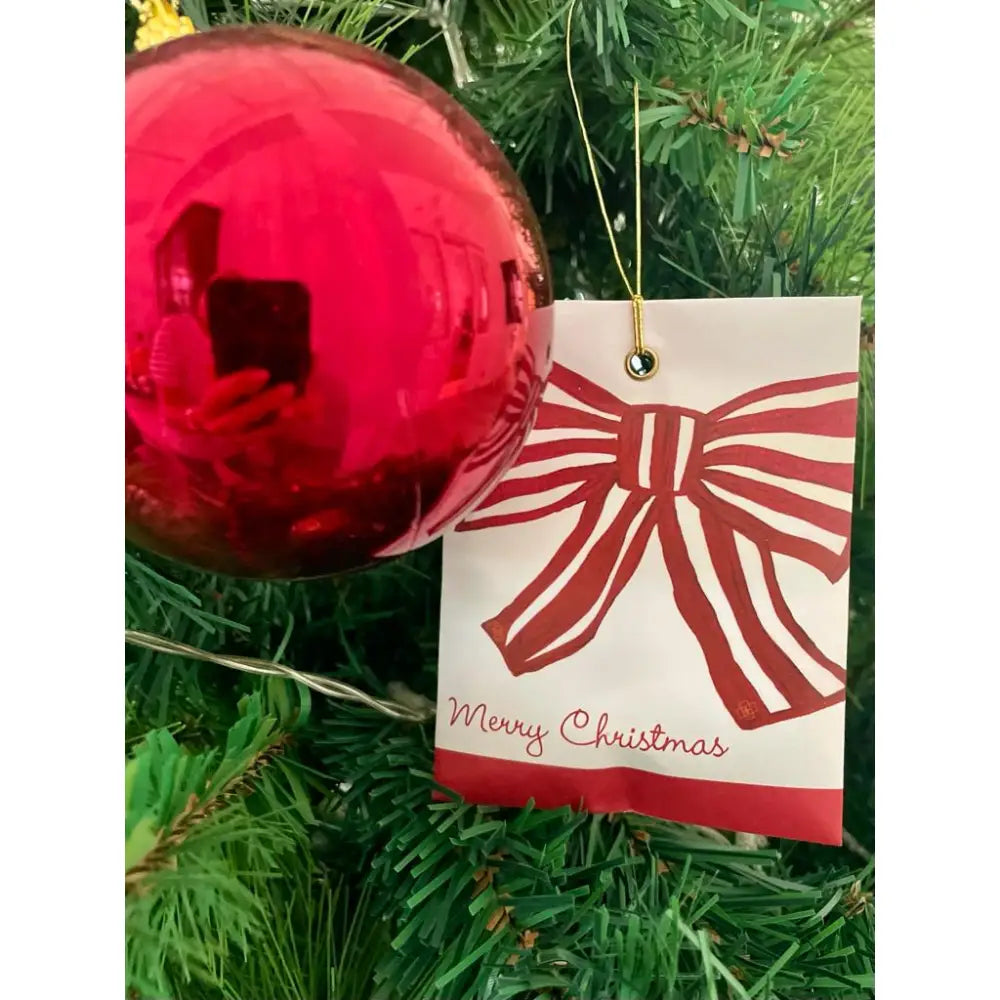 Red Christmas tree ornament with a Merry Christmas tag for festive season diffuser decor