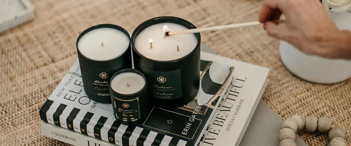 Three dark green candles with white wax.